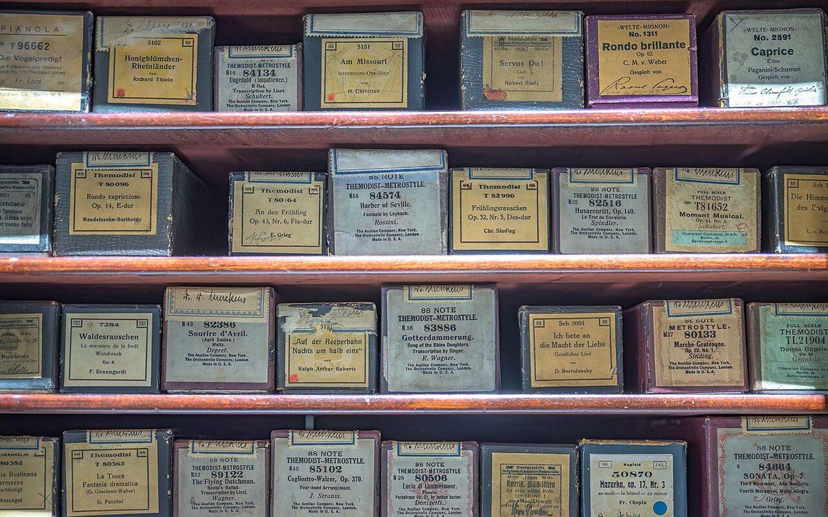 Collection of piano rolls in their original boxes in Collections of the Deutsches Museum