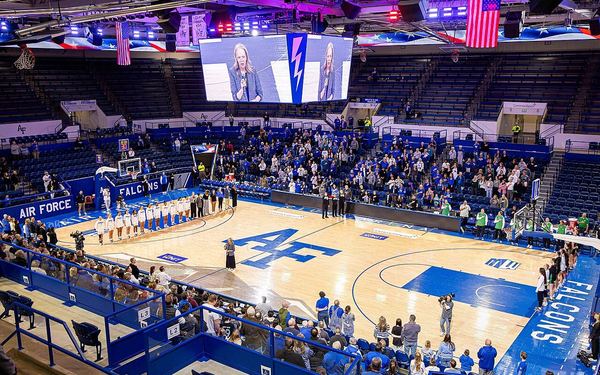 Air Force and Utah Valley basketball players during the National Anthem before the opening round of the WNIT a